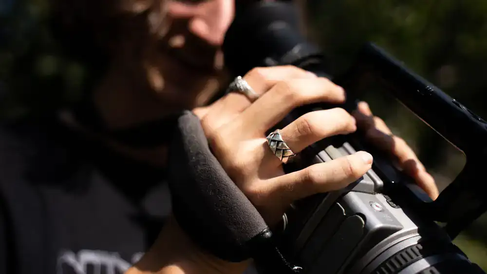 Close up of a handcrafted silver ring on an anvil