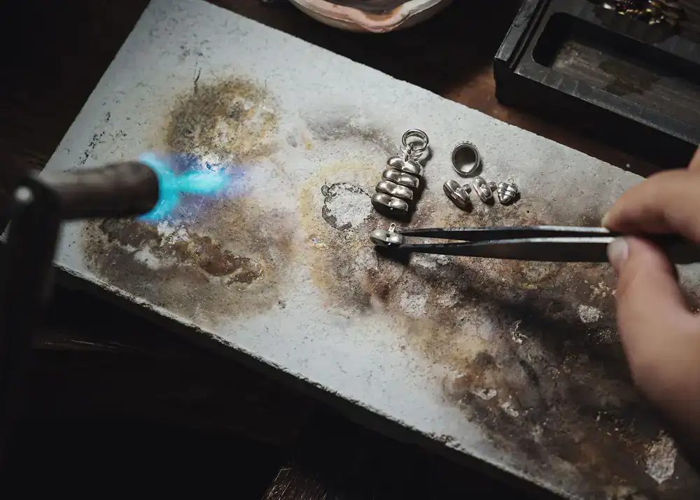 Silversmith discussing design concepts with a client