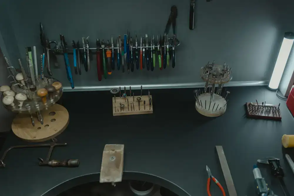 Polishing wheels and cleaning tools on a jeweller's workbench